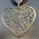 Dove and heart pendant