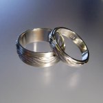 Water on sand wedding rings